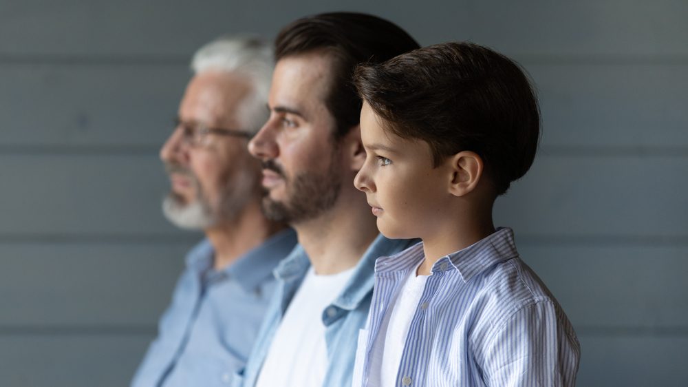 Profile view of three generations of males