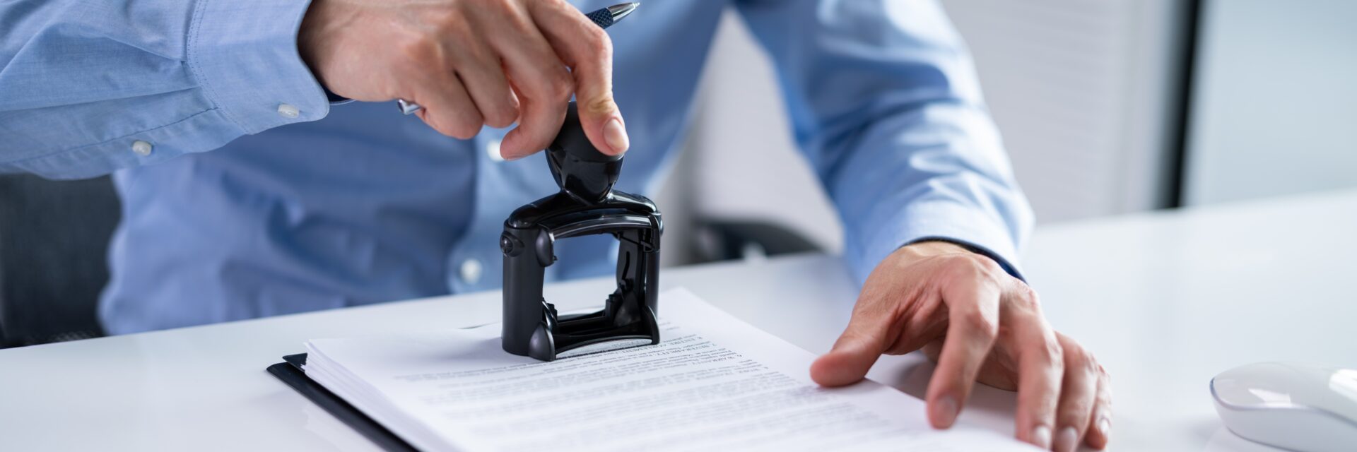 A man sealing a document representing a Certified Copy of a Will.