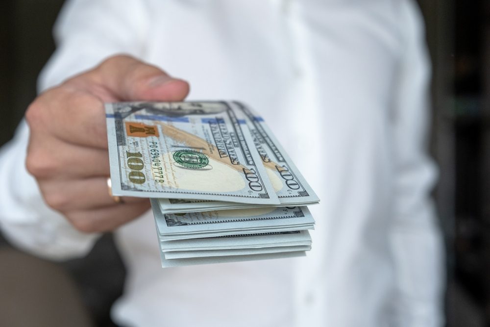 Man handing Probate Advance money