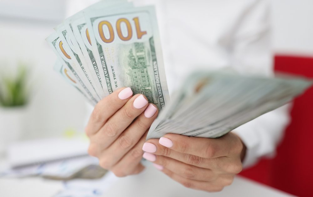 Woman counting Inheritance Advance money