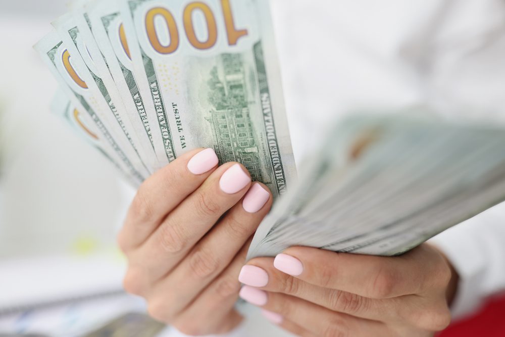 Woman counting Inheritance Advance cash