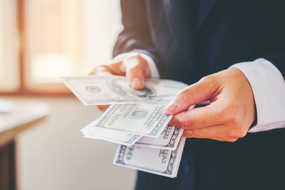 Cash bills illustrating an inheritance advance under North Dakota Probate Law