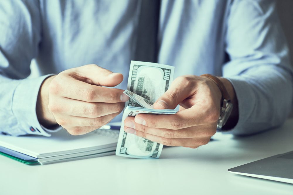 Cash bills illustrating an inheritance advance under New Jersey Probate Law.