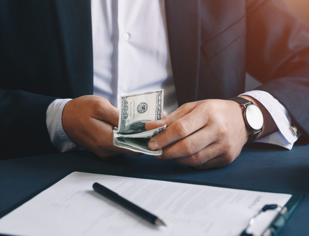 Cash bills illustrating an inheritance advance under New Mexico Probate Law.